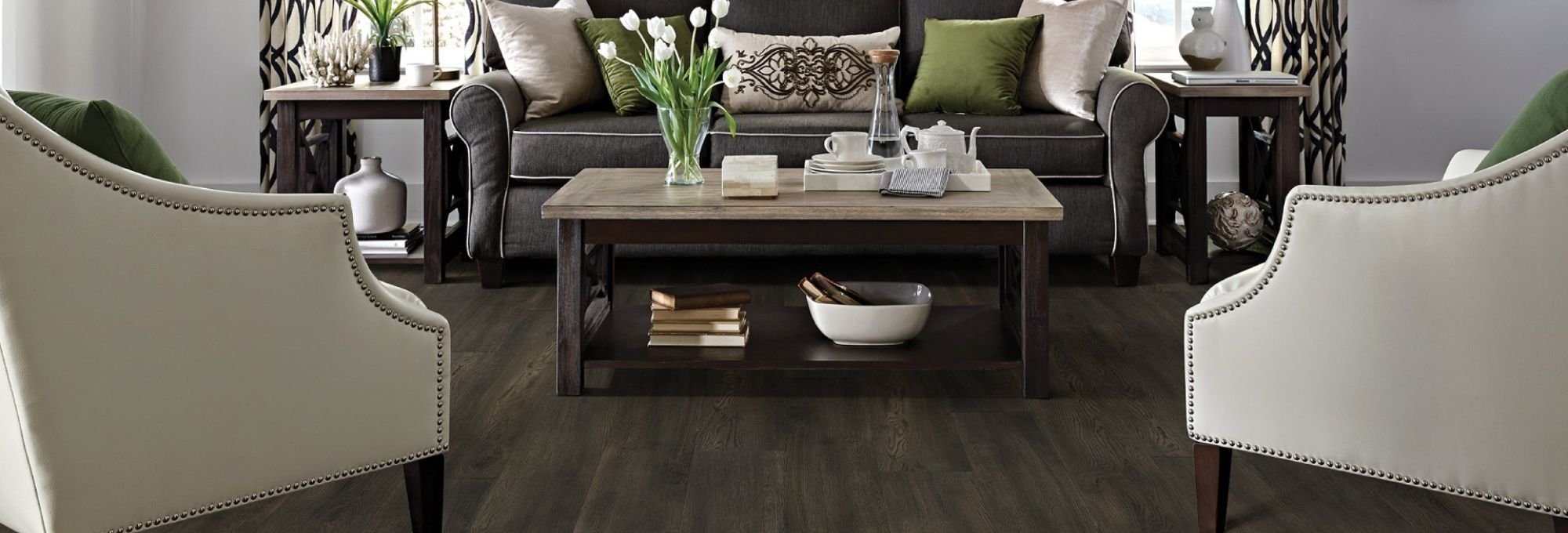 living room with wood-look laminate flooring from Carpet Design Center in the Greenville, NC area