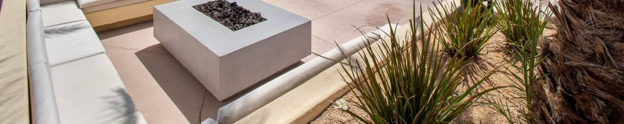 Woman choosing from flooring swatches in store - Carpet Design Center in the Greenville, NC area