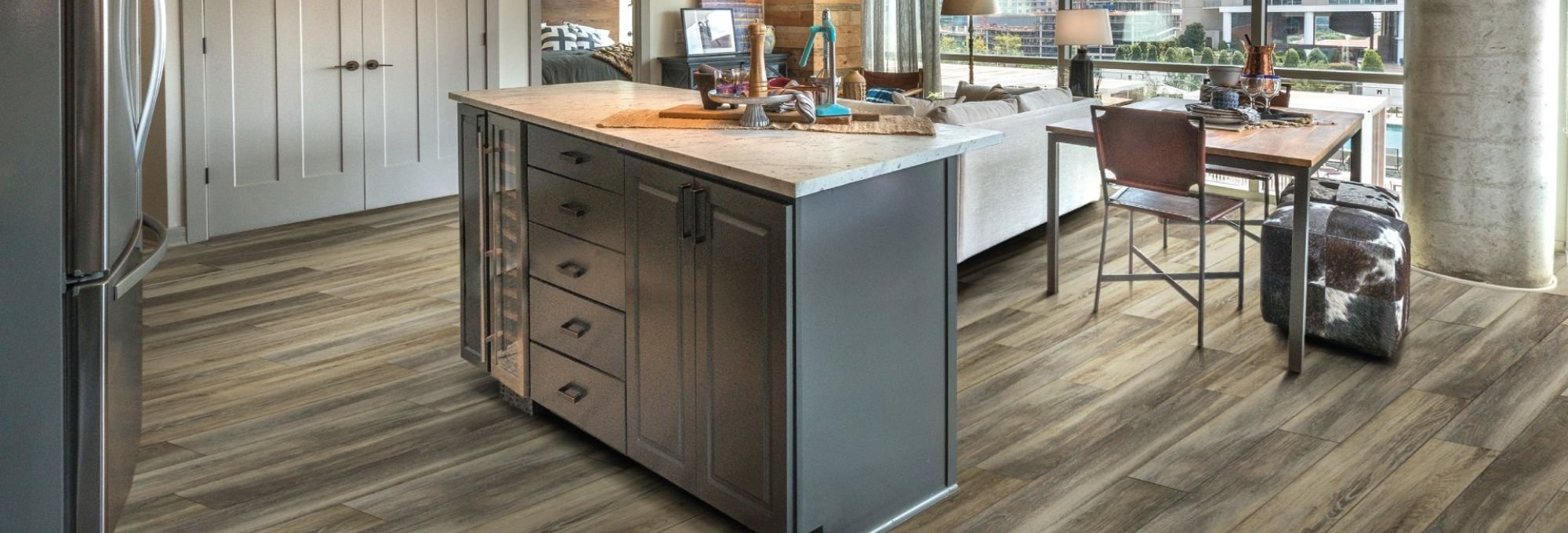 Kitchen with wood look luxury vinyl flooring from Carpet Design Center in the Greenville, NC area